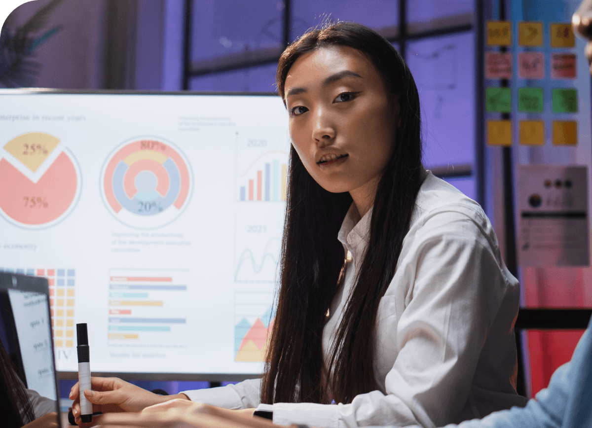 Recruiter reviewing candidate analytics on multiple screens